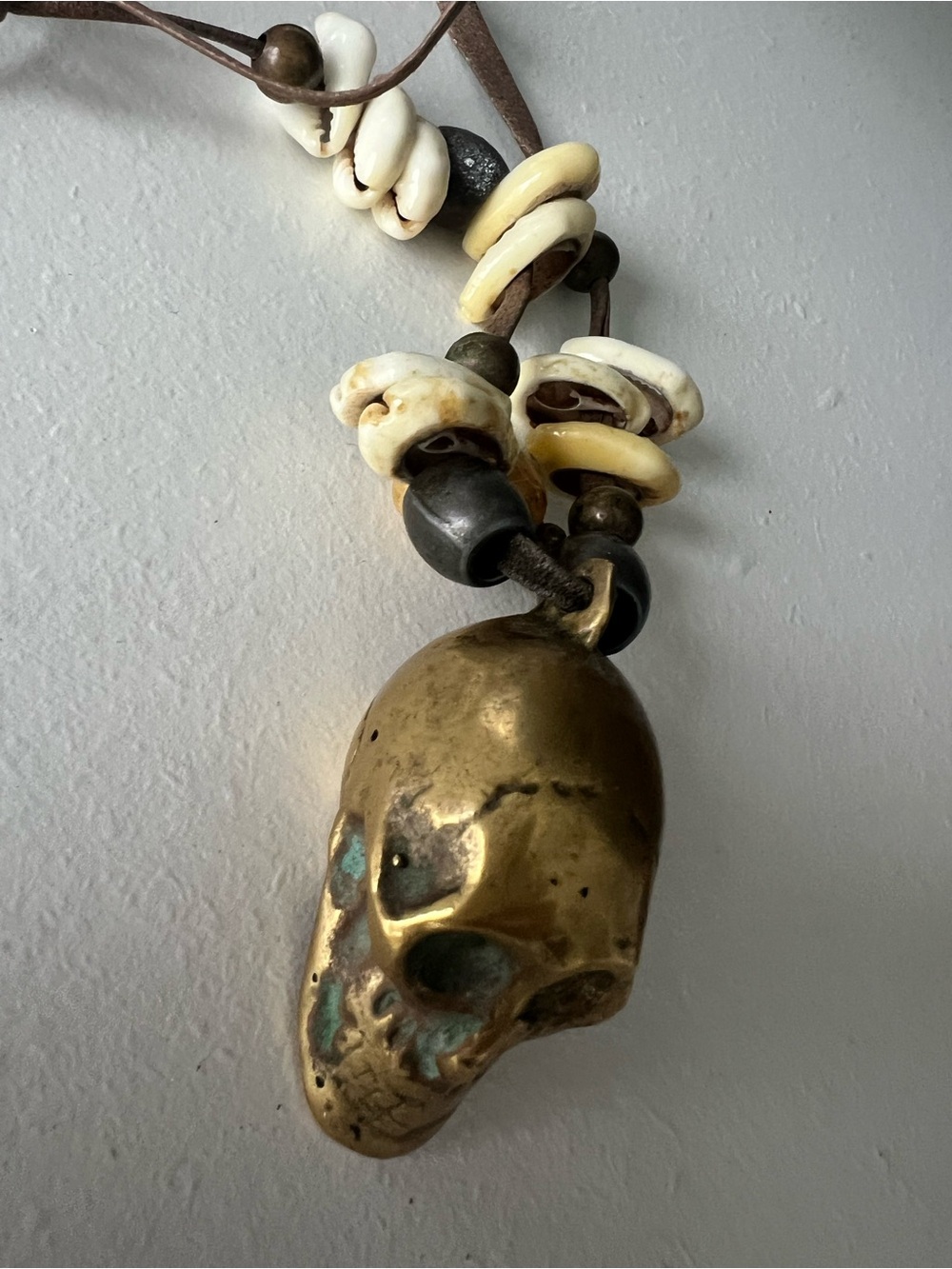 Brass Skull Pendant Necklace with Cream Bead Accents